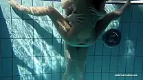 Naked teens underwater swimming and playing